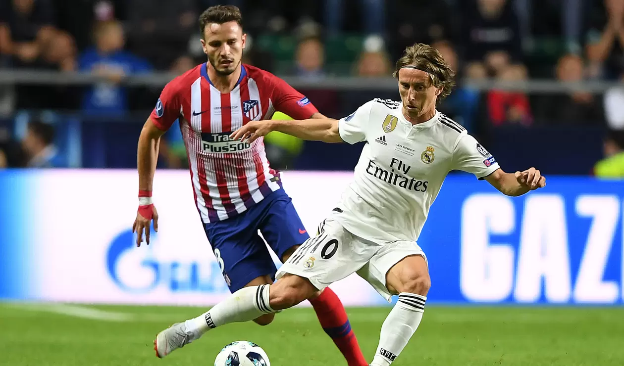 Saúl Níguez (Atlético de Madrid) y Luka Modric (Real Madrid)