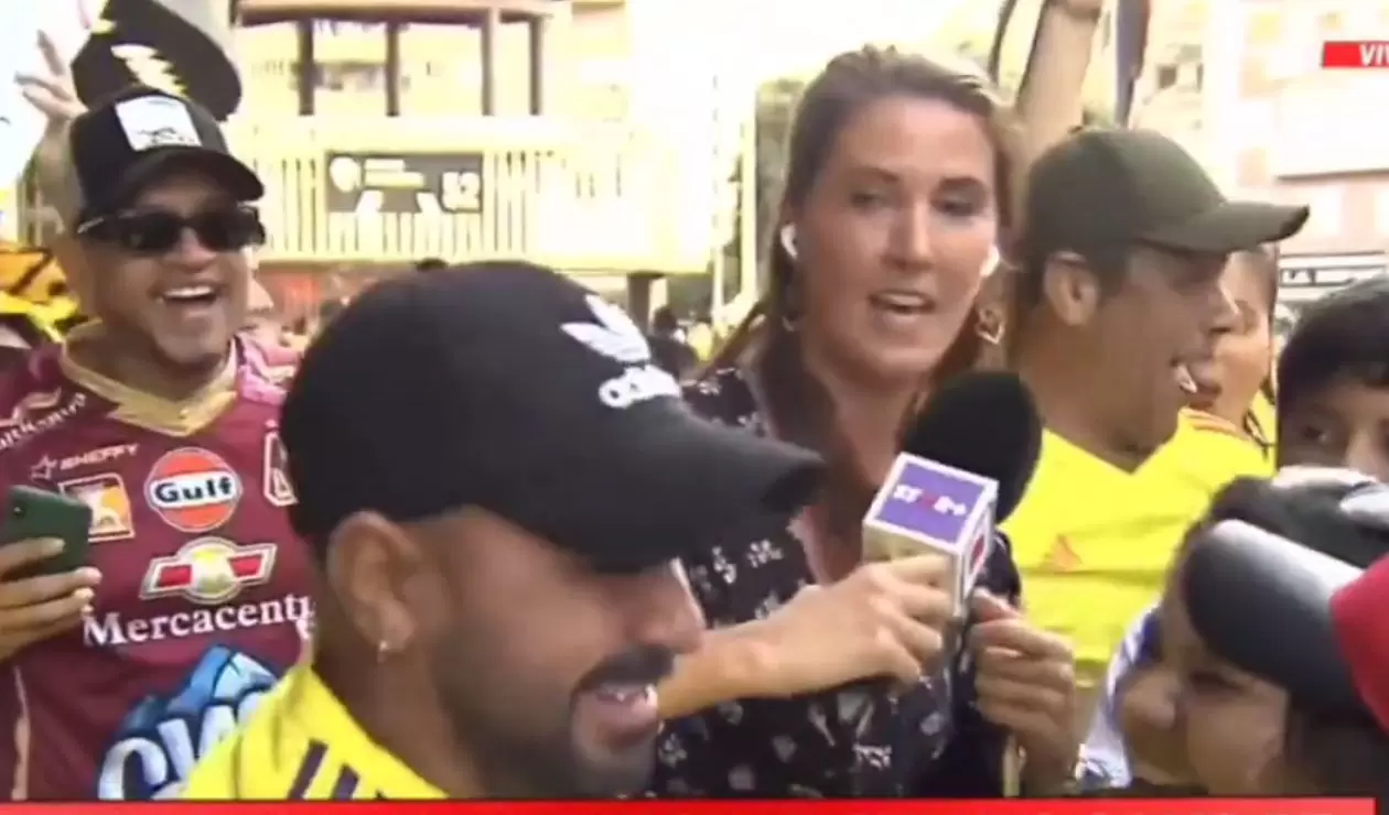 hincha intentando besar a periodista en Colombia vs Irak