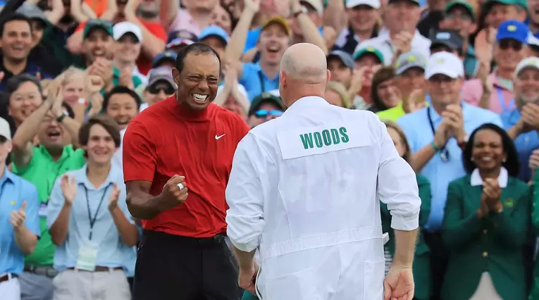 Tiger Woods y su caddie